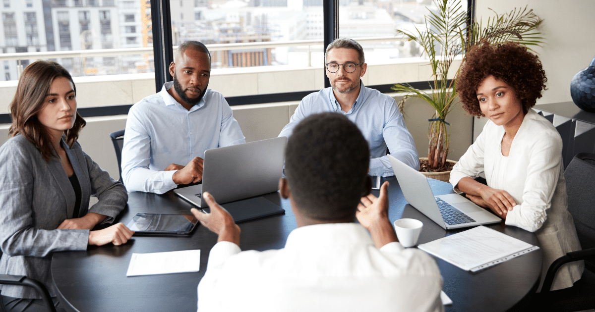 picture-of-HR-professional-leading-team-meeting-iq-academy