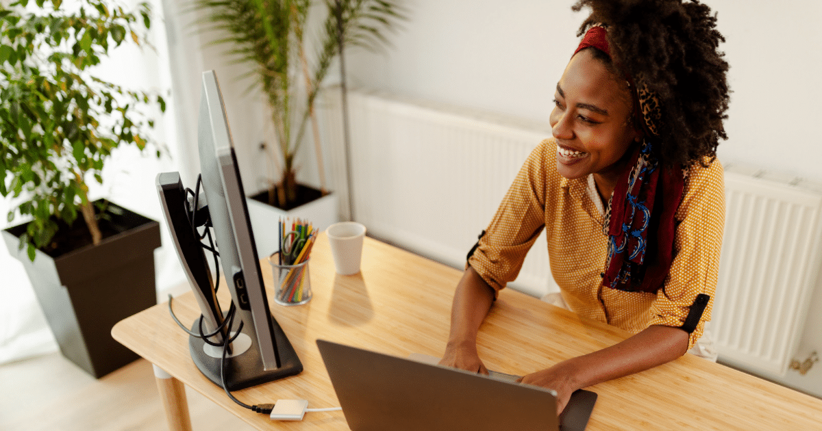 woman studying a free course online at a desk